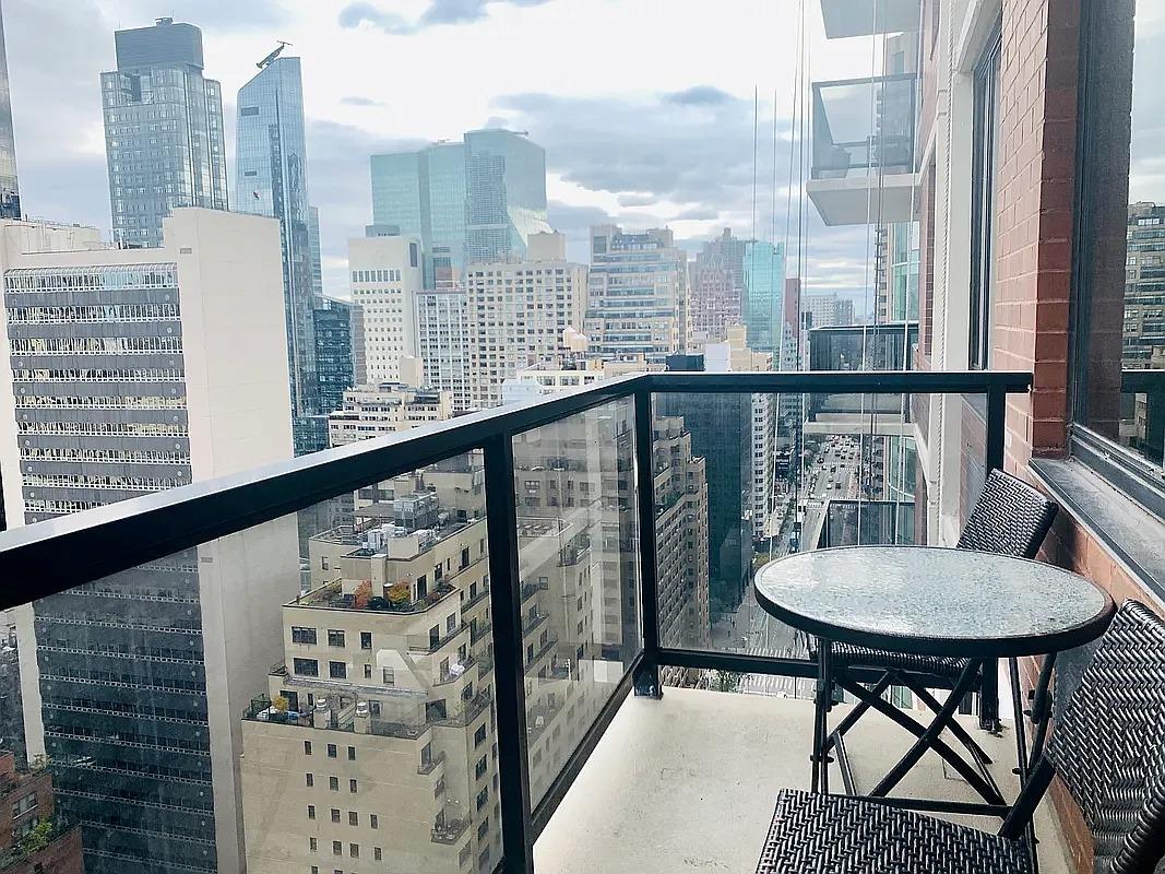 255 East 49th Street, Unit 31C Manhattan, NY 10017 - Photo 2 of 11 a view of a balcony with furniture