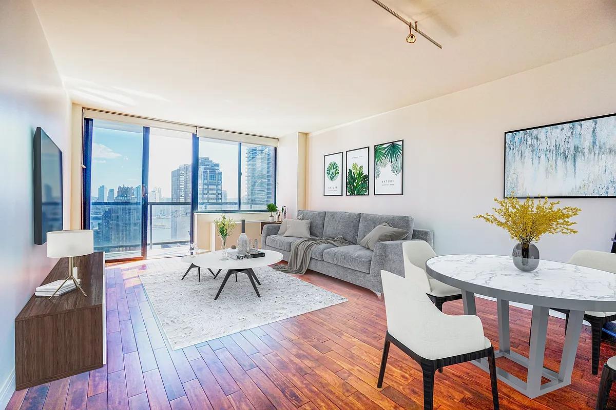 255 East 49th Street, Unit 31C Manhattan, NY 10017 - Photo 6 of 11 a living room with furniture and a wooden floor