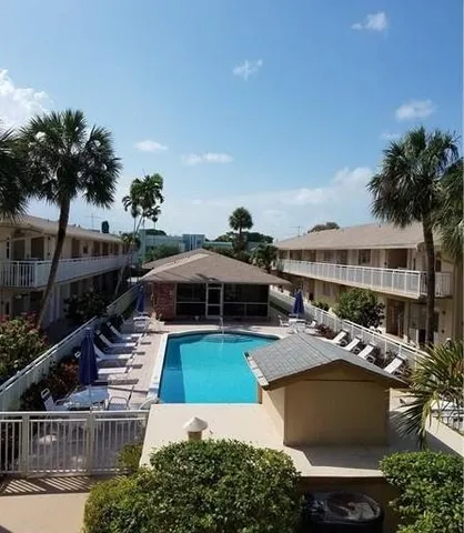 a view of a house with swimming pool