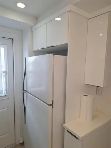 a bathroom with a shower and a sink
