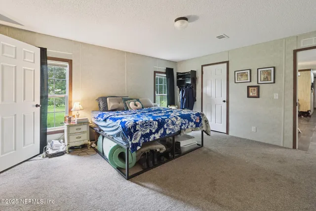 a bedroom with a bed and a cabinets