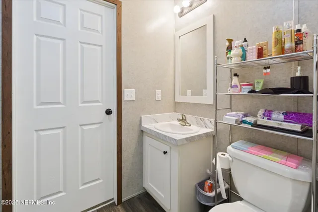 a utility room with sink dryer and washer