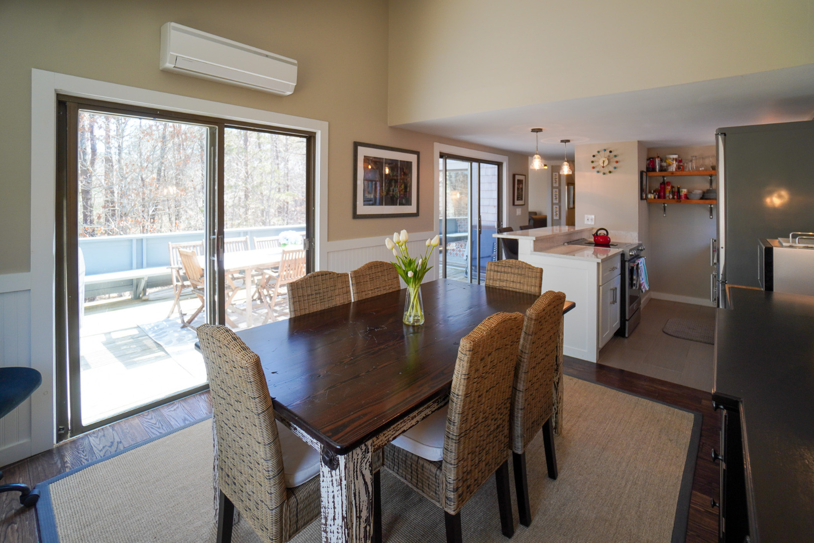4 Quail Run Road, Unit 14 Oak Bluffs, MA 02557 - Photo 5 of 29 2 Sliders and Efficient Heat Pump to a large deck with bench seats