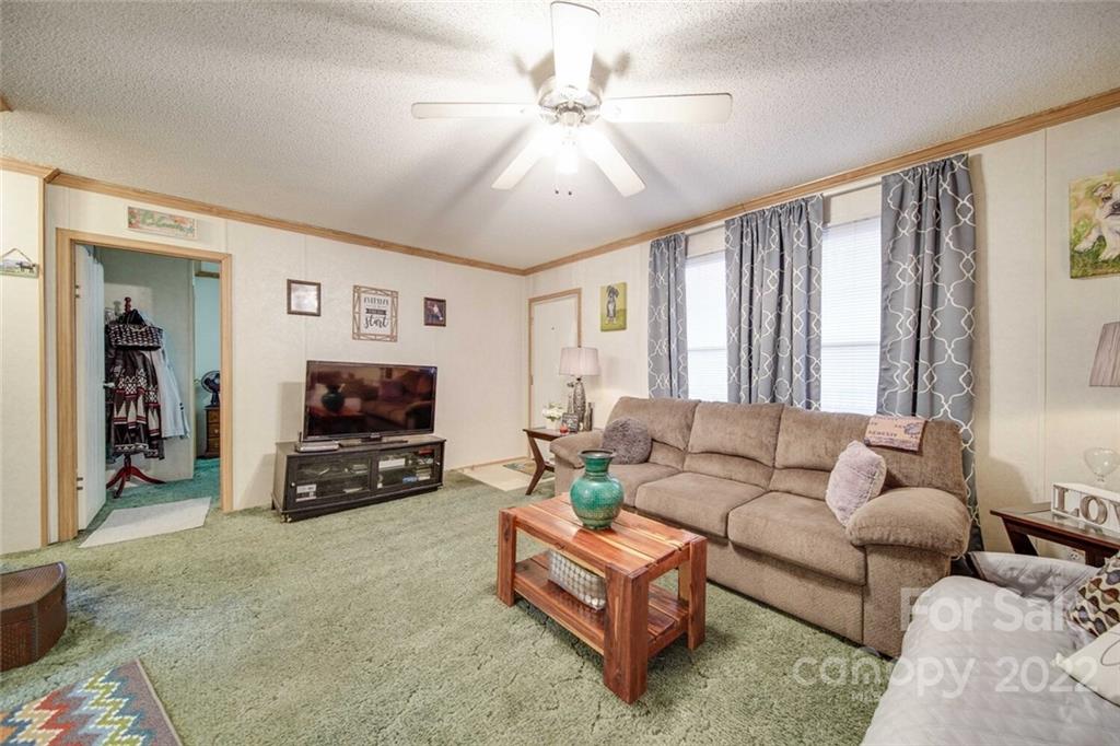 158 Smith Valley Road Sharon, SC 29742 - Photo 12 of 41 a living room with furniture and a flat screen tv