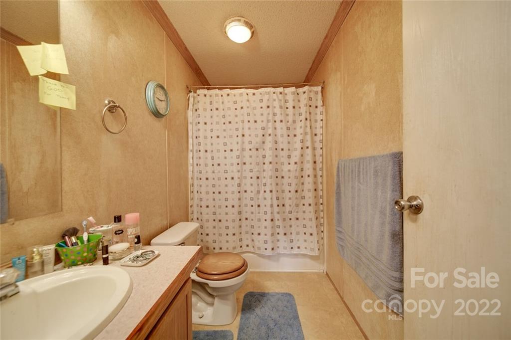 158 Smith Valley Road Sharon, SC 29742 - Photo 15 of 41 a bathroom with a sink toilet and shower