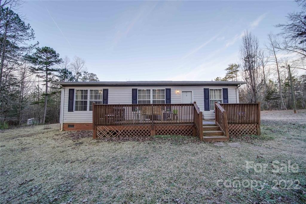 158 Smith Valley Road Sharon, SC 29742 - Photo 38 of 41 a backyard of a house with barbeque oven table and chairs