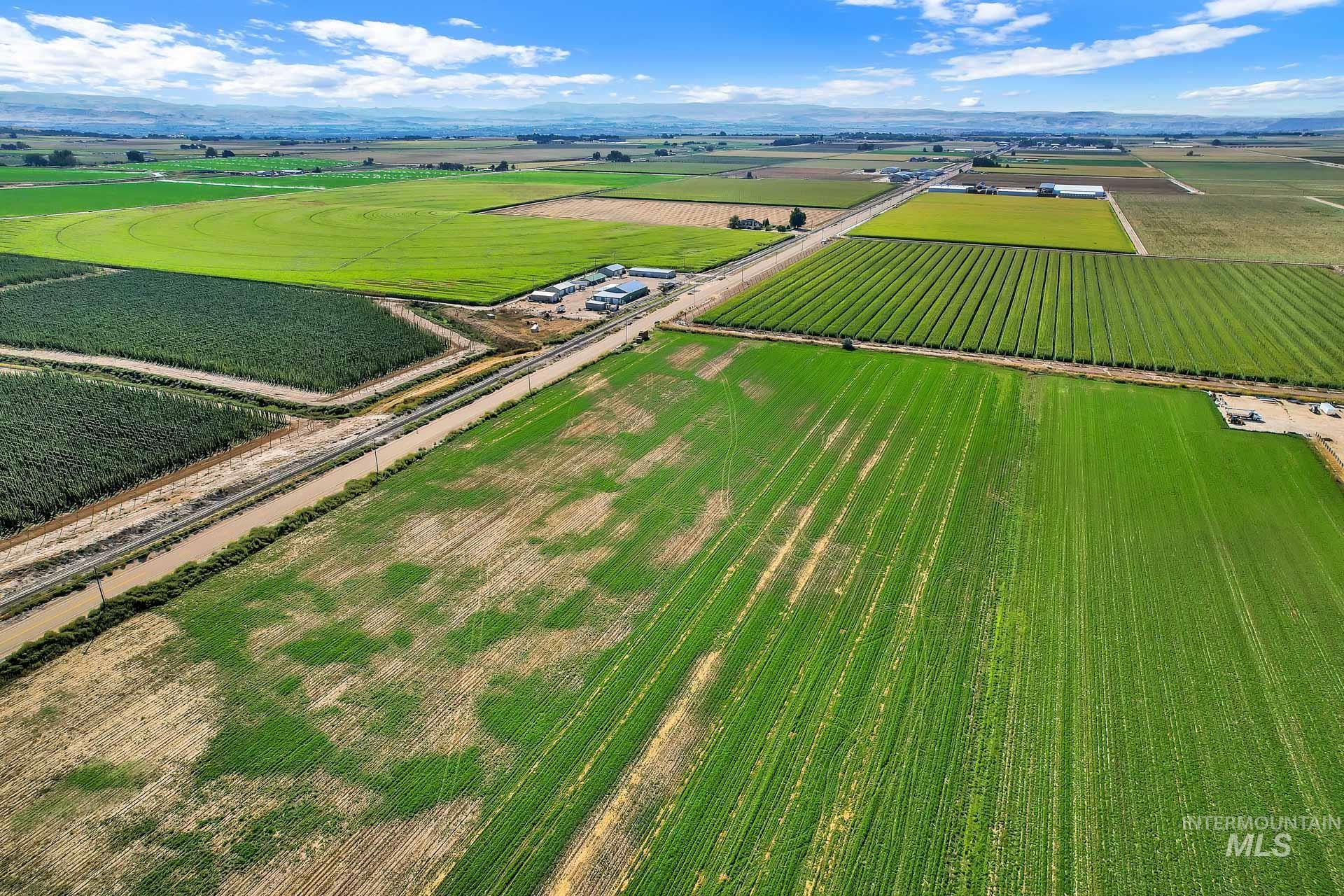 0 Peckham Road Wilder, ID 83676 - Photo 6 of 9 Aerial view of sparsely populated area featuring large plots for crops