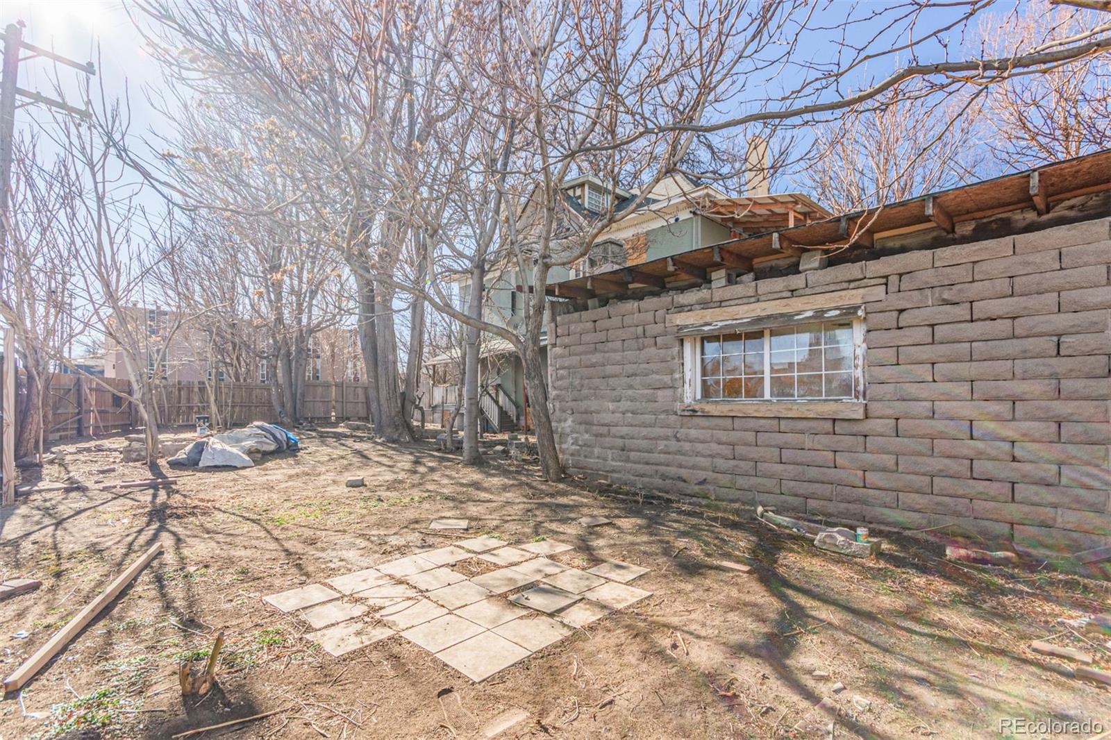 1632 York Street Denver, CO 80206 - Photo 12 of 13 a view of a backyard with a tree