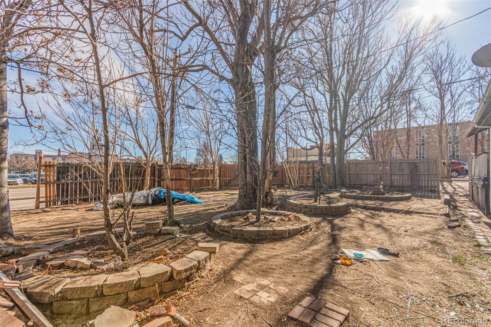 1632 York Street Denver, CO 80206 - Photo 13 of 13 a view of a backyard with snow on the road