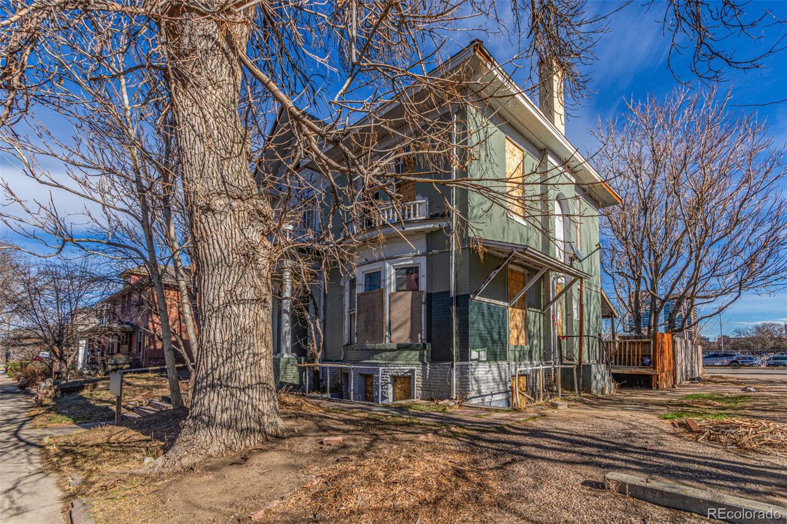 1632 York Street Denver, CO 80206 - Photo 5 of 13 a view of a house with a yard covered with snow