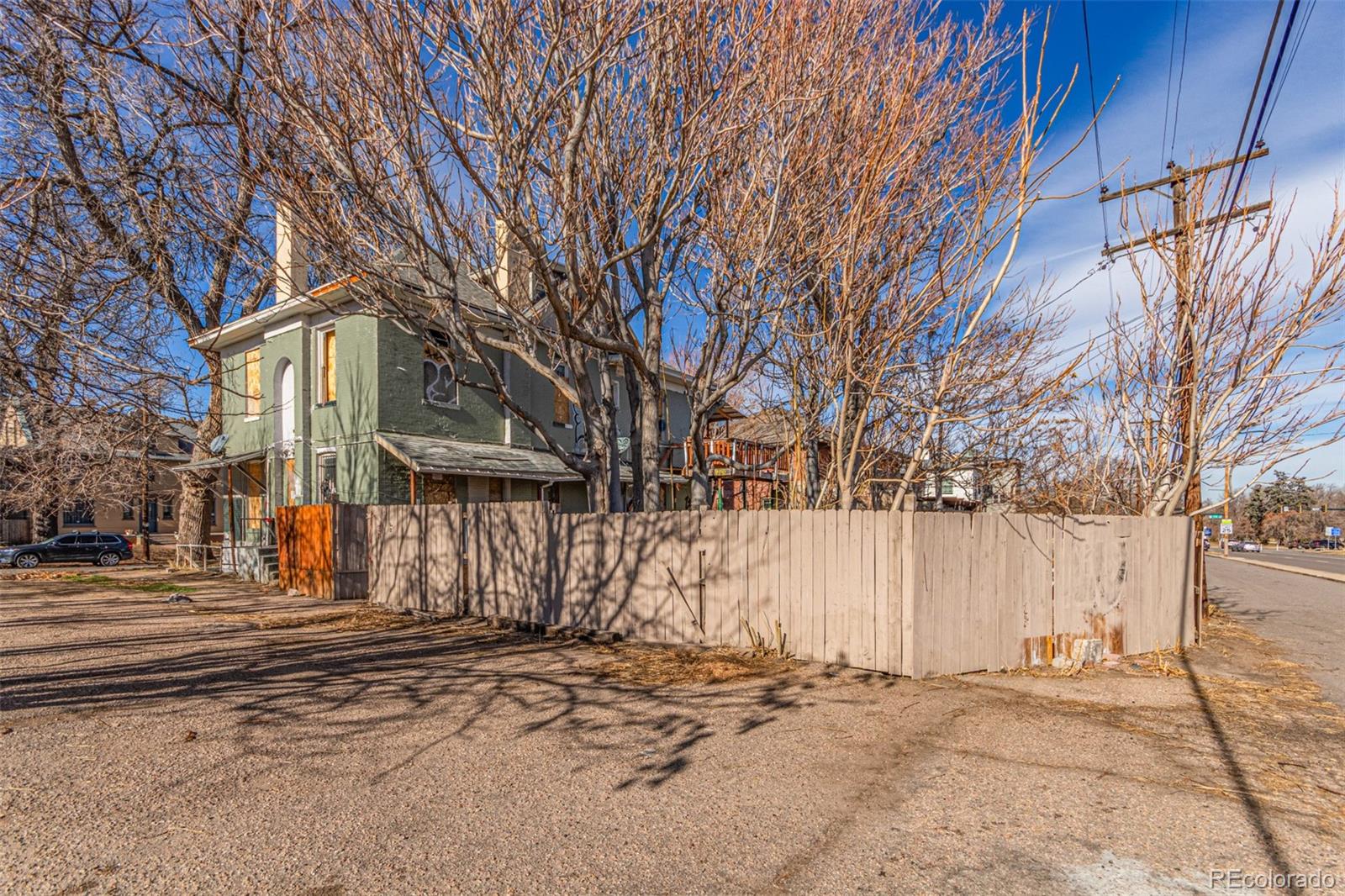 1632 York Street Denver, CO 80206 - Photo 7 of 13 a front view of a house with a snow on the road