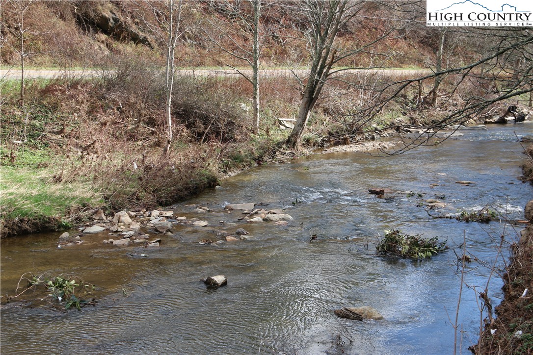 Big Laurel Road Creston, NC 28615 - Photo 2 of 27 a view of a fire pit with large trees