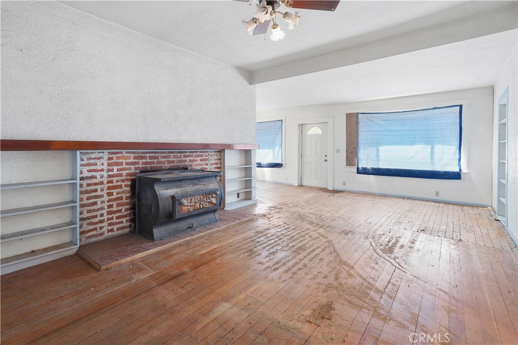 2010 Ladder Ridge Road Upper Lake, CA 95485 - Photo 23 of 75 a view of a room with a fireplace cabinet and windows