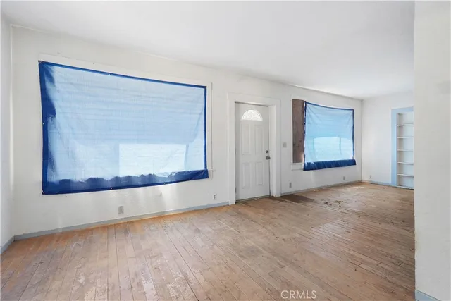 a view of a kitchen with furniture and a ceiling fan