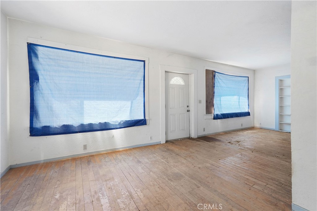 2010 Ladder Ridge Road Upper Lake, CA 95485 - Photo 28 of 75 a view of an empty room with wooden floor and a window