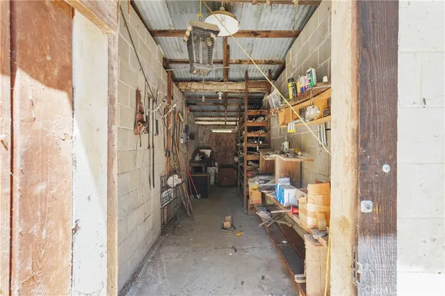 a view of a hallway with wooden floor and entryway