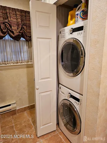 a bathroom with a shower and a bath tub