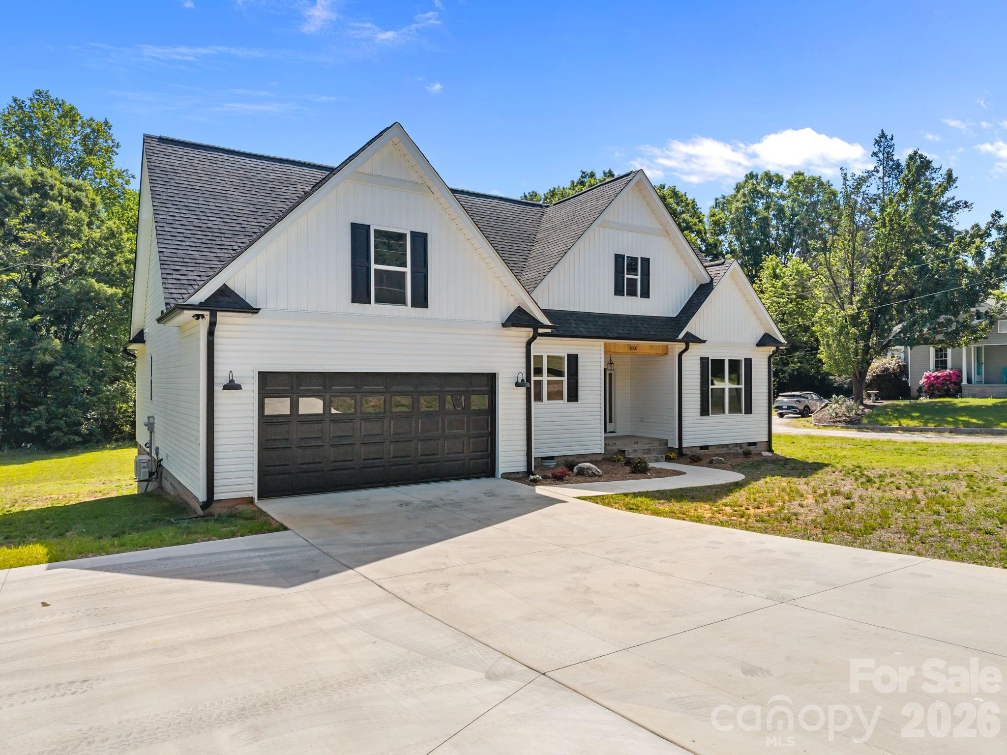 5037 Faith Road Salisbury, NC 28146 - Photo 2 of 45 a front view of a house with a yard