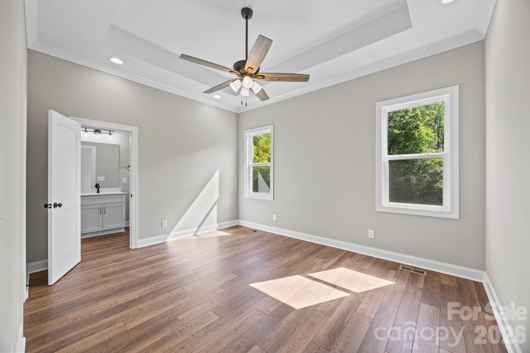 5037 Faith Road Salisbury, NC 28146 - Photo 22 of 45 a view of an empty room with wooden floor and a window