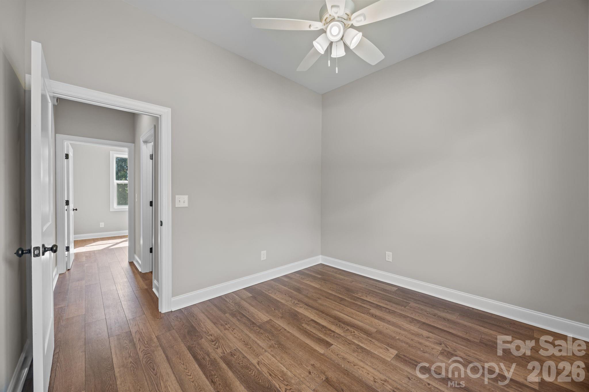 5037 Faith Road Salisbury, NC 28146 - Photo 28 of 45 wooden floor in an empty room with a window