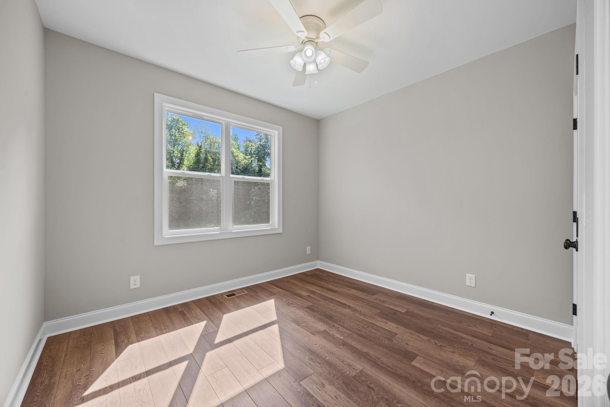 5037 Faith Road Salisbury, NC 28146 - Photo 30 of 45 a view of room with window and ceiling fan