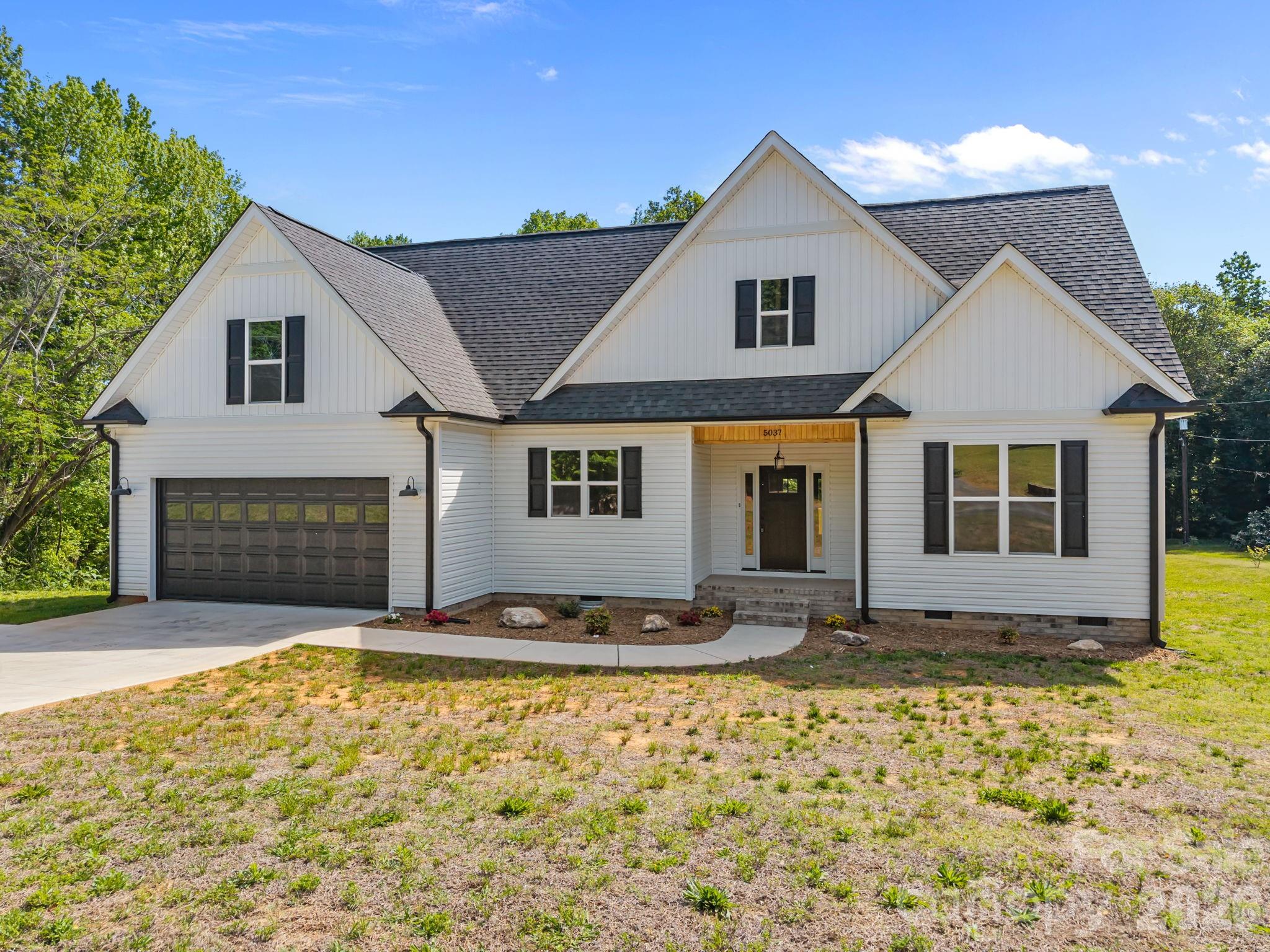 5037 Faith Road Salisbury, NC 28146 - Photo 3 of 45 a front view of a house with yard