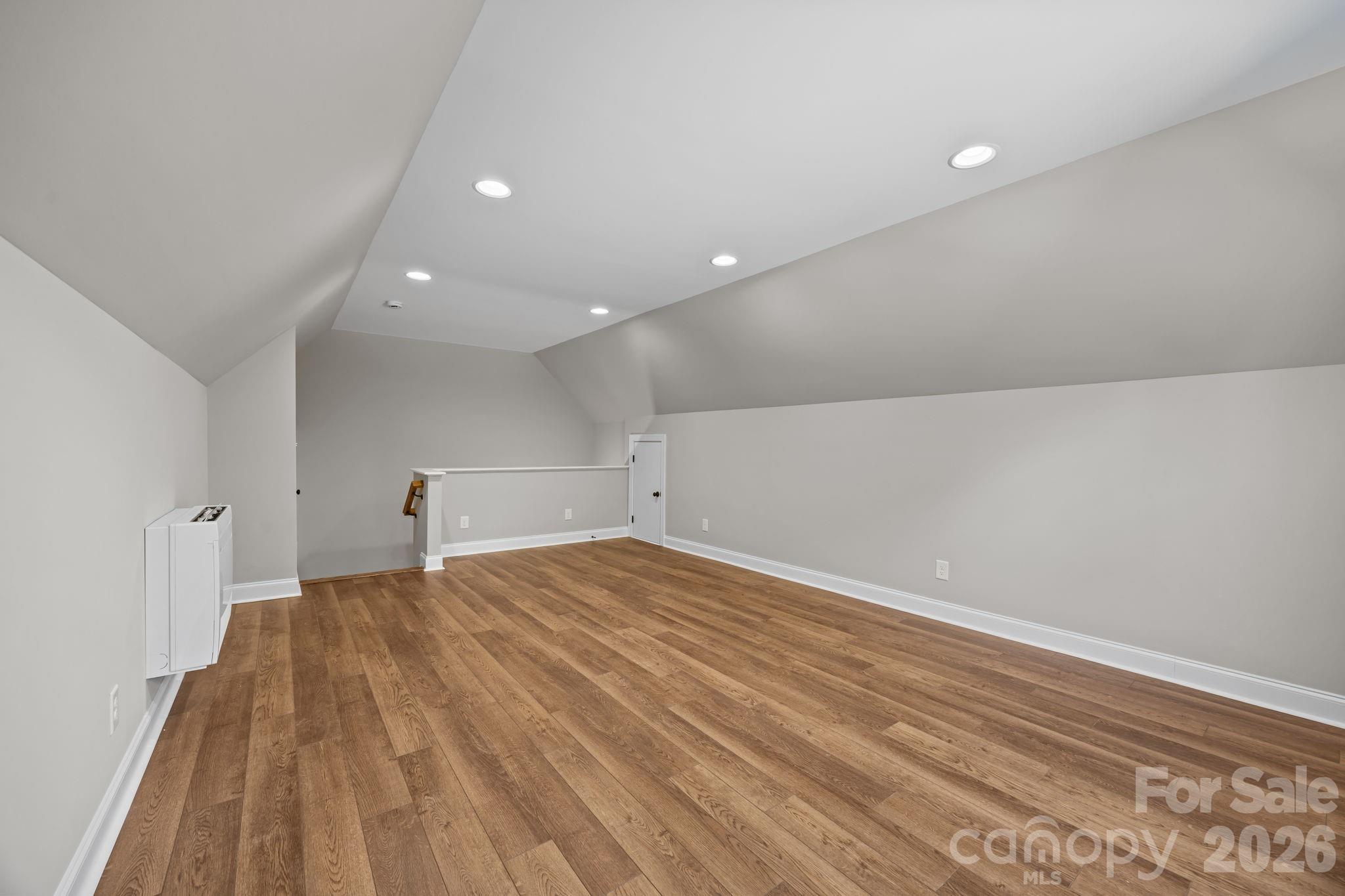 5037 Faith Road Salisbury, NC 28146 - Photo 32 of 45 a view of empty room with wooden floor