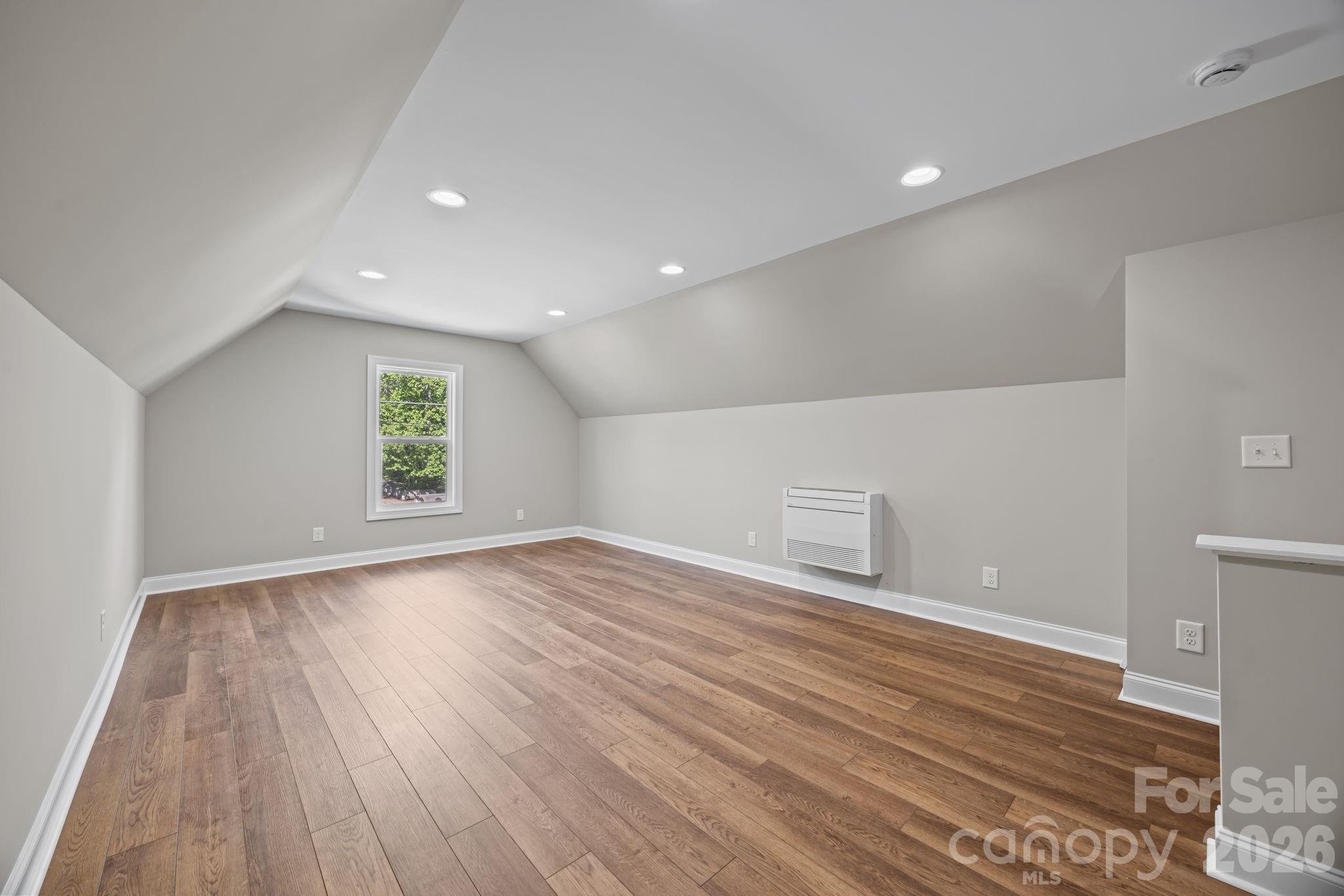 5037 Faith Road Salisbury, NC 28146 - Photo 33 of 45 wooden floor in an empty room with a window