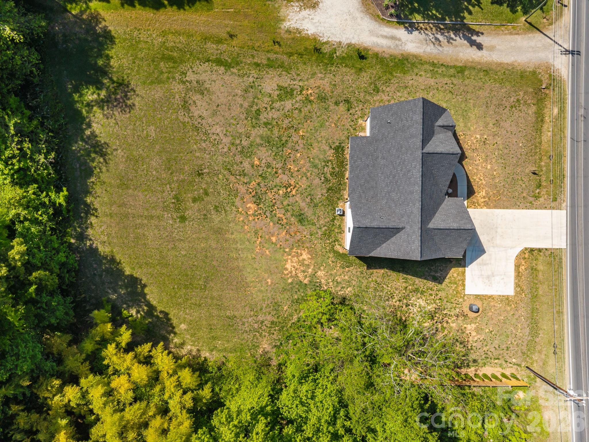 5037 Faith Road Salisbury, NC 28146 - Photo 42 of 45 an aerial view of residential house with pool