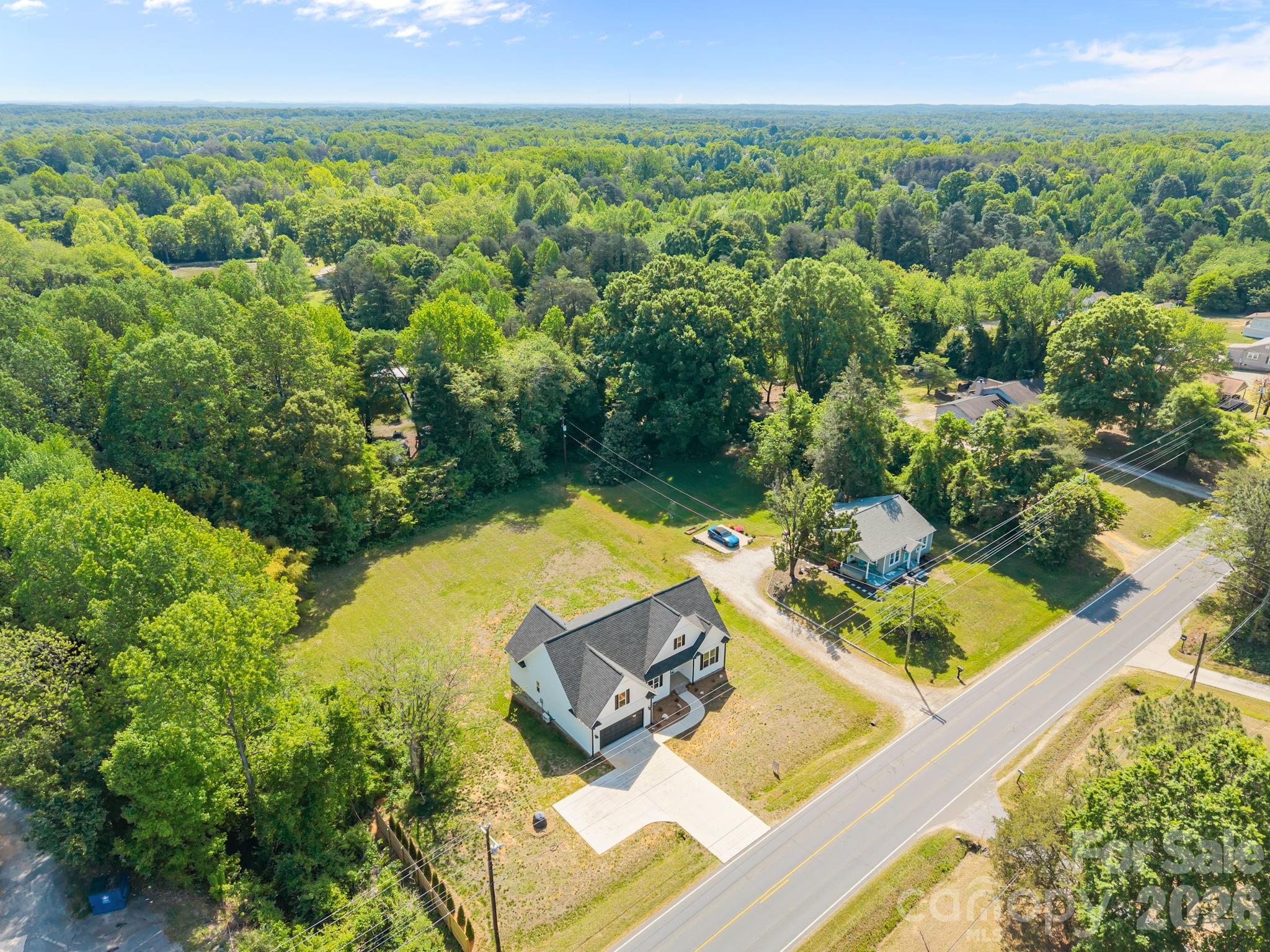 5037 Faith Road Salisbury, NC 28146 - Photo 43 of 45 an aerial view of a house with a swimming pool