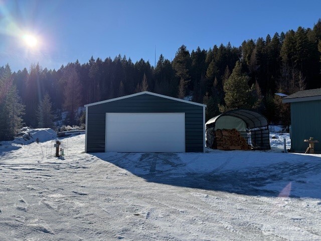 94 Grafton Road Wauconda, WA 98859 - Photo 2 of 37 a front view of a house with a yard