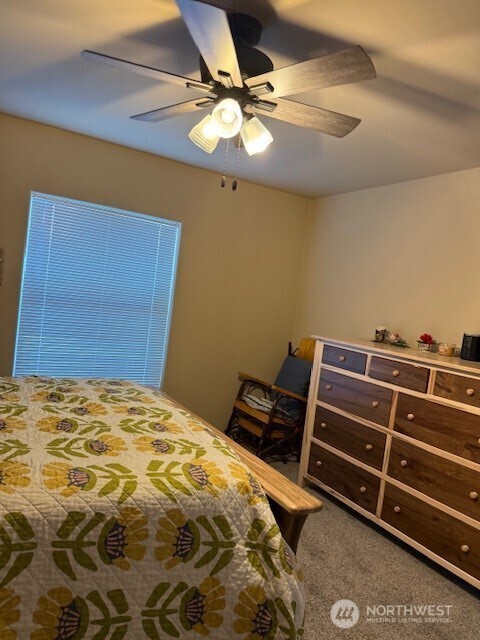 94 Grafton Road Wauconda, WA 98859 - Photo 24 of 37 a bedroom with a bed and a ceiling fan