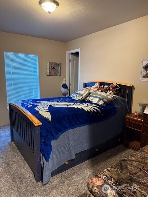 94 Grafton Road Wauconda, WA 98859 - Photo 34 of 37 a bedroom with a bed and a window