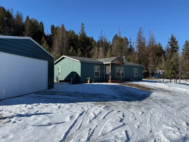 a house with trees in the background