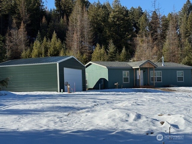 94 Grafton Road Wauconda, WA 98859 - Photo 8 of 37 a view of a house with a yard