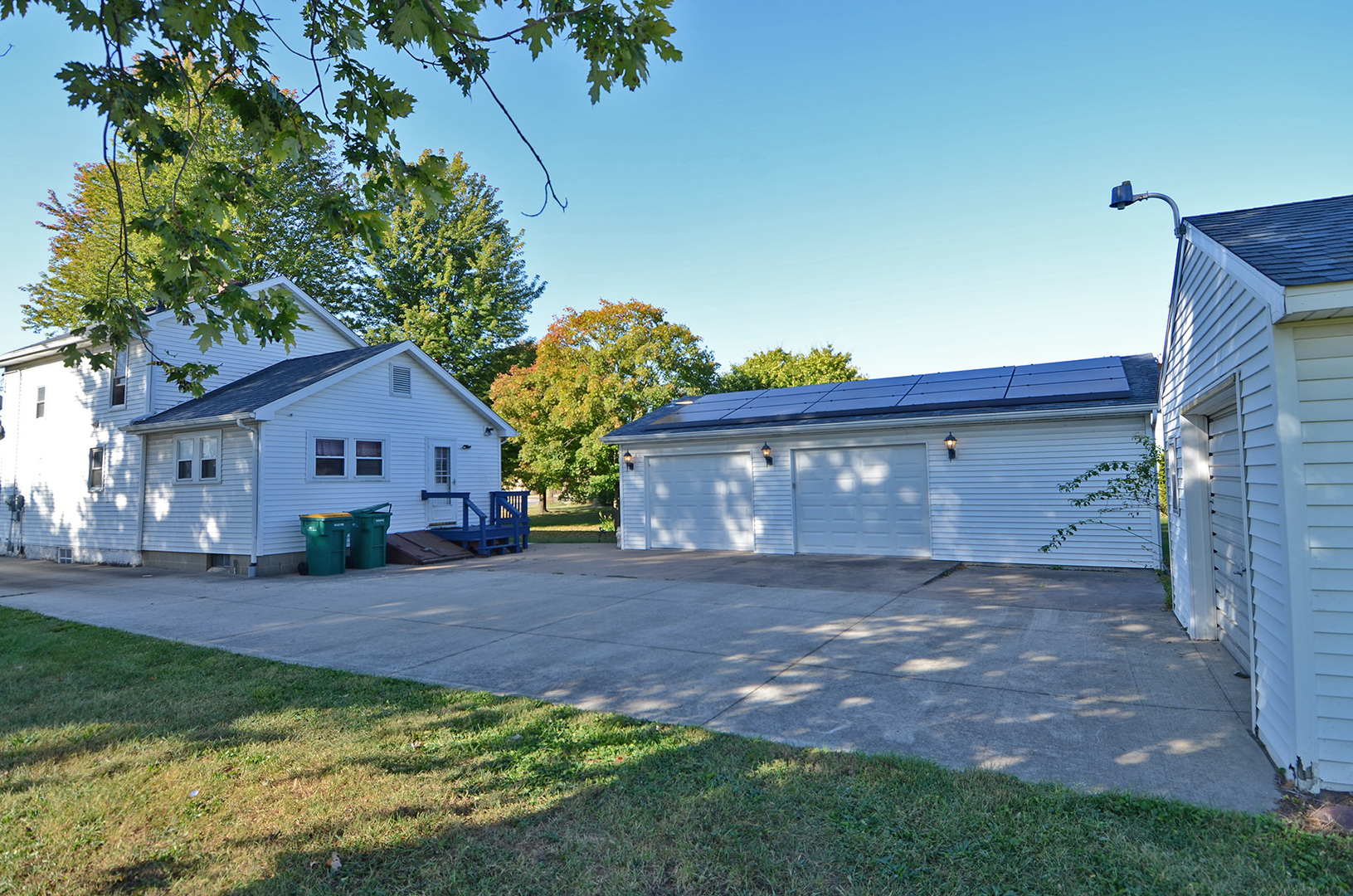 708 Lundy Street Streator, IL 61364 - Photo 1 of 21 a front view of house with yard and trees in the background