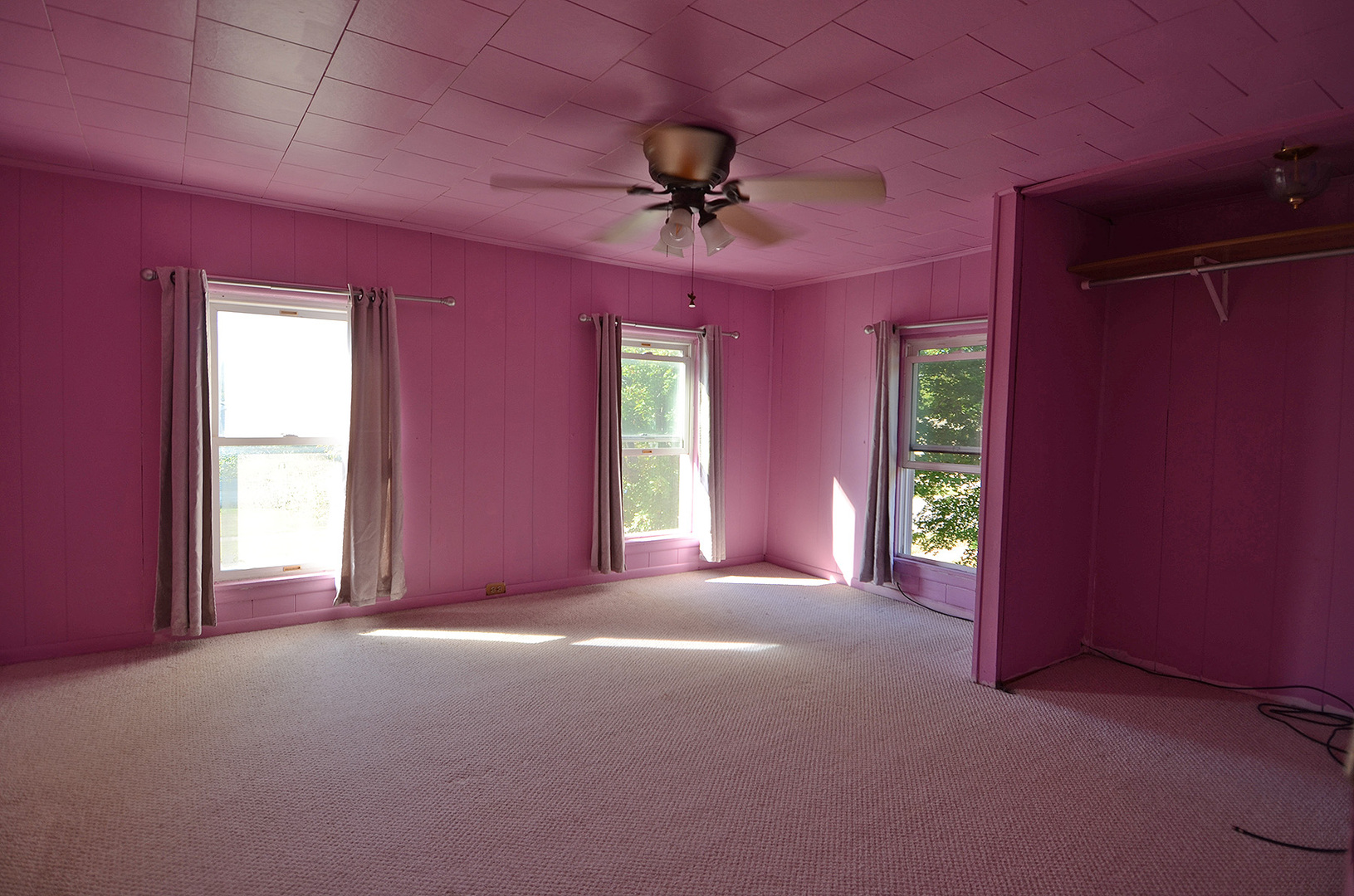 708 Lundy Street Streator, IL 61364 - Photo 11 of 21 a view of a livingroom with a chandelier fan and windows