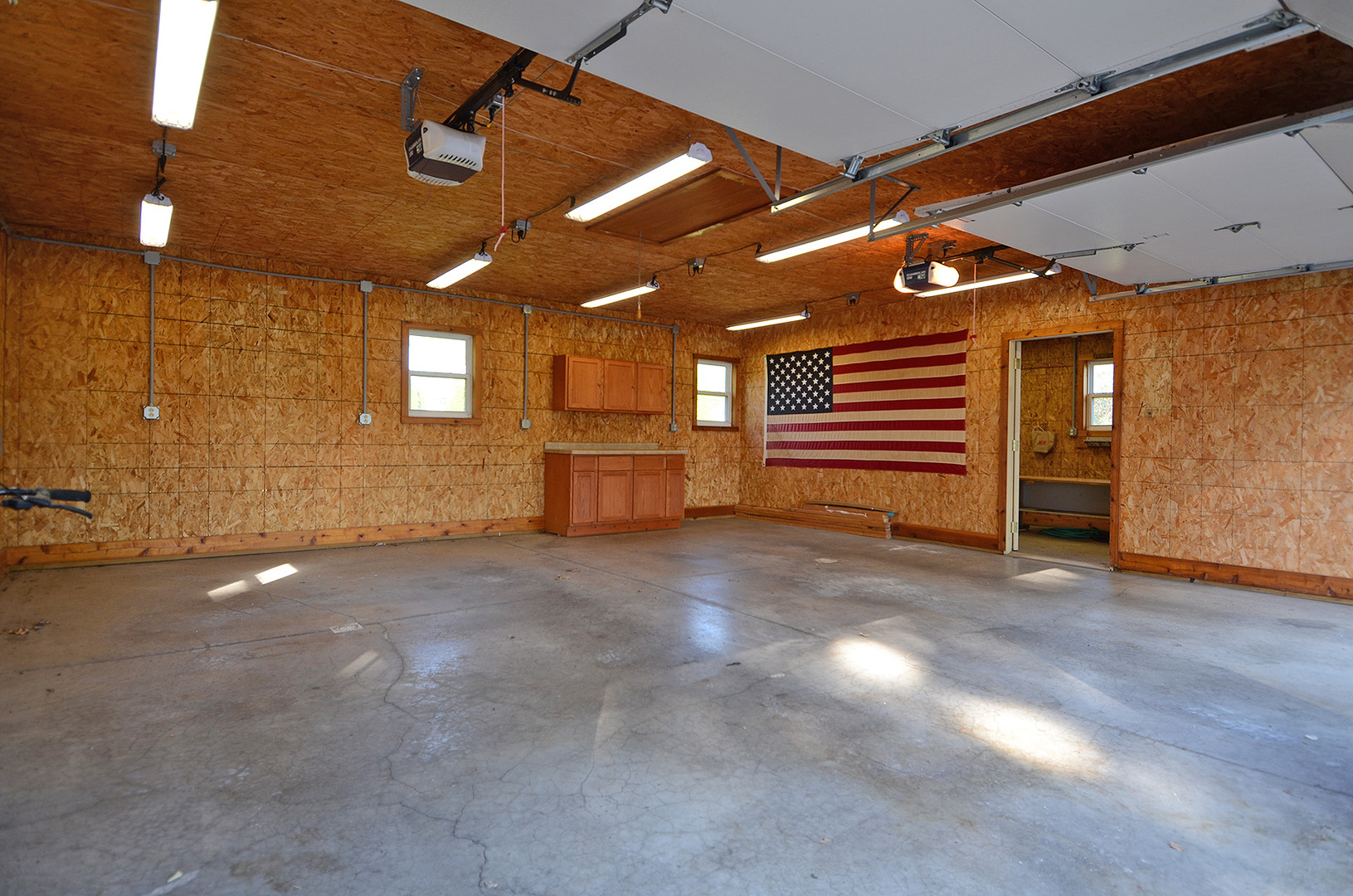 708 Lundy Street Streator, IL 61364 - Photo 4 of 21 a view of empty room with stairs and wooden floor