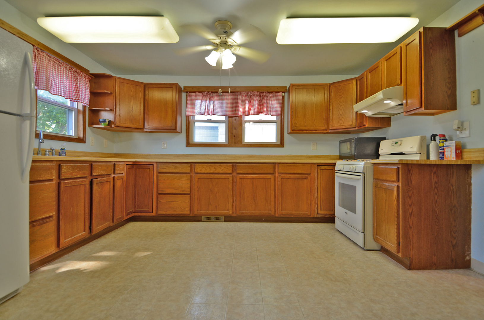708 Lundy Street Streator, IL 61364 - Photo 7 of 21 a kitchen with a sink cabinets and window