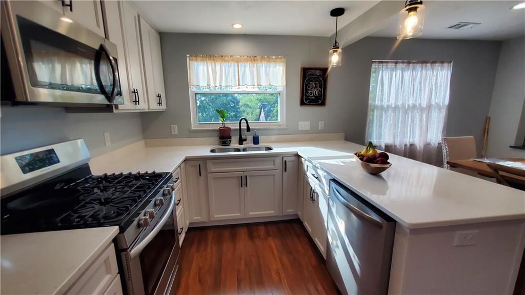 12106 Center Street Irwin, PA 15642 - Photo 12 of 27 a kitchen that has a sink a stove and window