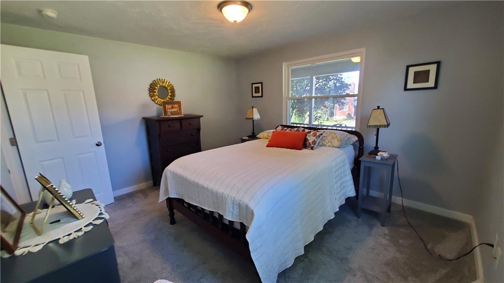 12106 Center Street Irwin, PA 15642 - Photo 19 of 27 a bedroom with a bed and a window