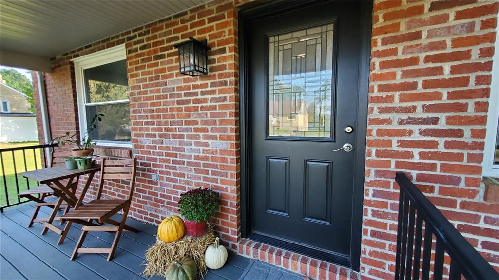 12106 Center Street Irwin, PA 15642 - Photo 2 of 27 a view of a balcony with chairs and a potted plant