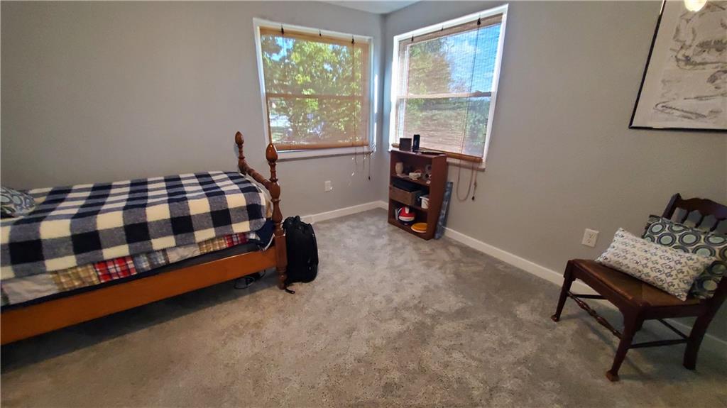 12106 Center Street Irwin, PA 15642 - Photo 22 of 27 a room with a bed chair and a window