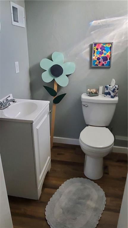 12106 Center Street Irwin, PA 15642 - Photo 26 of 27 a bathroom with a toilet a sink and a mirror