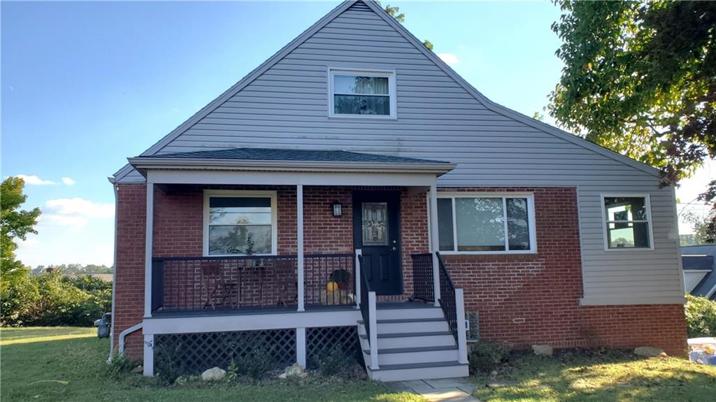 12106 Center Street Irwin, PA 15642 - Photo 5 of 27 a front view of a house with a yard