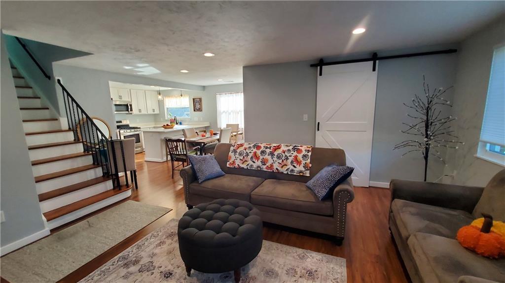 12106 Center Street Irwin, PA 15642 - Photo 6 of 27 a living room with furniture and a rug