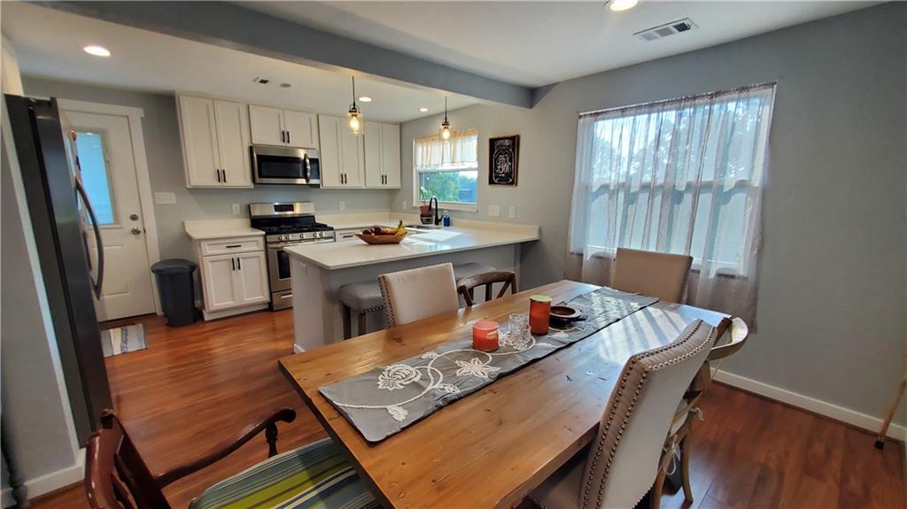 12106 Center Street Irwin, PA 15642 - Photo 9 of 27 a living room with stainless steel appliances furniture stove a sink dishwasher and a refrigerator