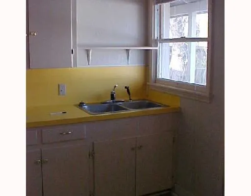 a bathroom with a sink and a window