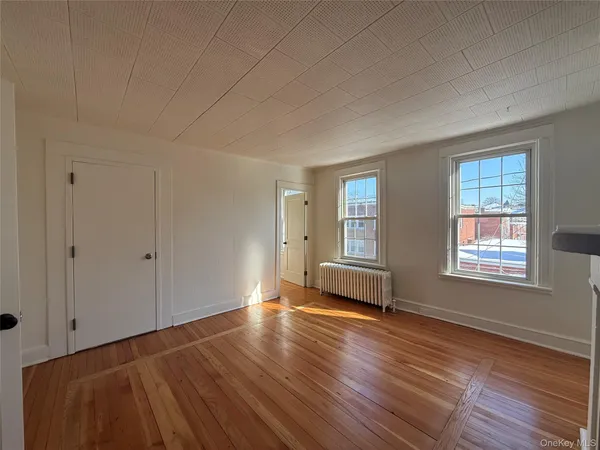 a view of livingroom with furniture wooden floor and window