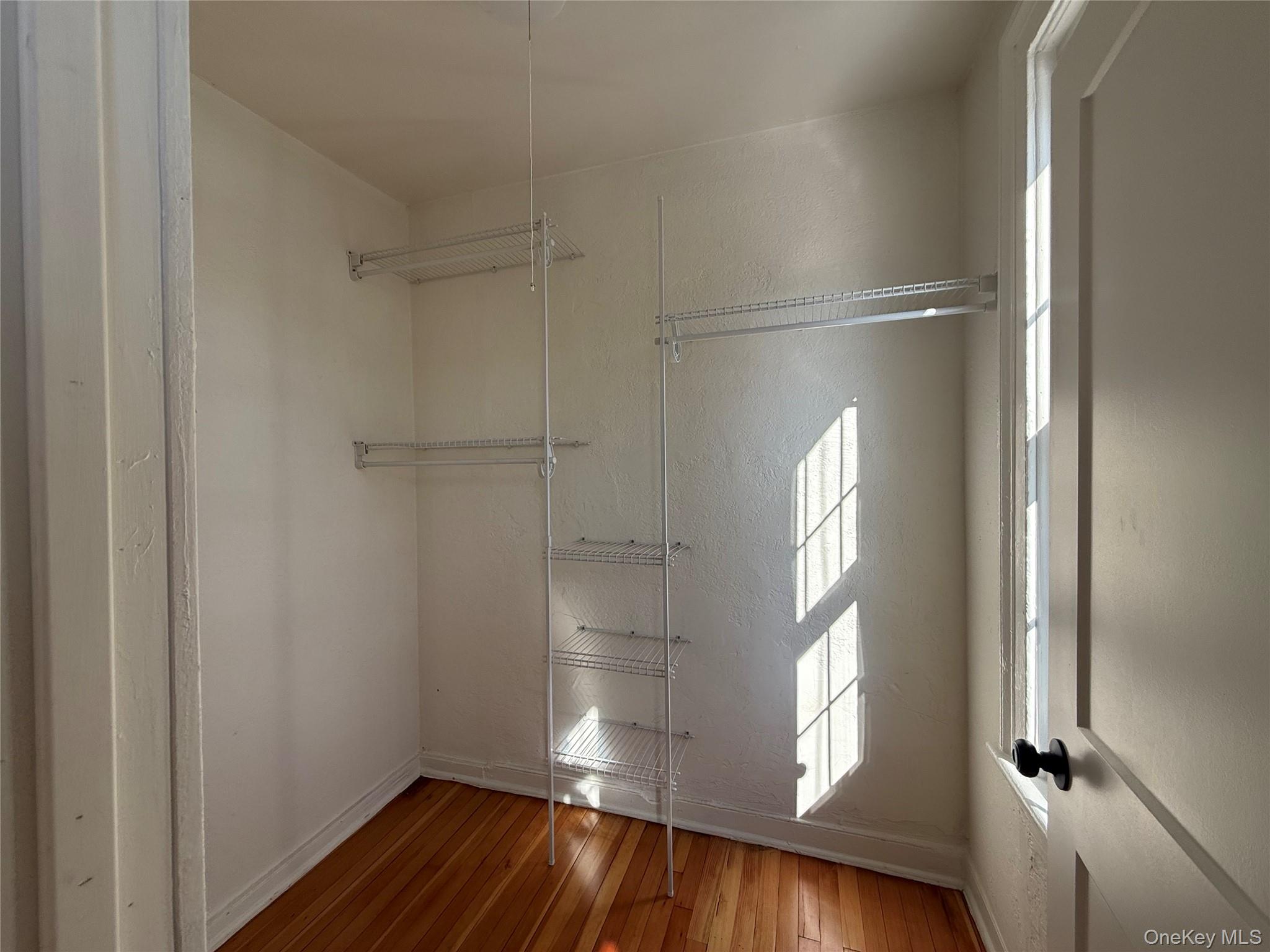40 North Clover Street Poughkeepsie, NY 12601 - Photo 8 of 11 a view of empty room with wooden floor and fan